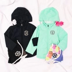Monogrammed Kids Lightweight Rain Jacket -Fashion Clothing Store nrS monogrammed lightweight rain jacket in black and mint with running shorts