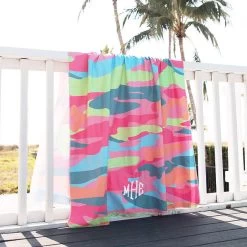 Monogrammed Lightweight Beach Towel -Fashion Clothing Store orI multi camo microfiber towel on railing