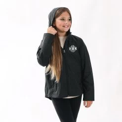 Monogrammed Kids Lightweight Rain Jacket -Fashion Clothing Store pON studio shot of youth black lightweight rain jacket