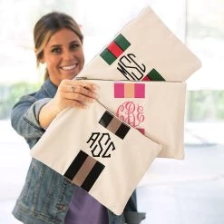 Monogrammed Canvas Pouch -Fashion Clothing Store rm6 girl holding all three canvas pouches