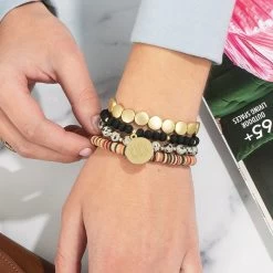 Monogrammed Fall Bracelet Stack -Fashion Clothing Store xMt monogrammed fall bracelet on wrist with colorblock sweatshirt