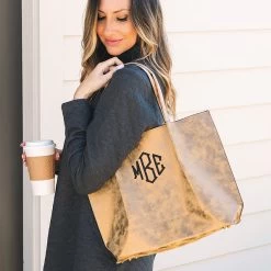 Monogrammed Distressed Metallic Tote Bag -Fashion Clothing Store zdd monogrammed distressed metallic tote bag on shoulder